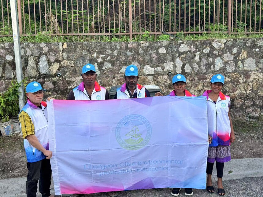 Association members holding the official Olive Environmental Association flag